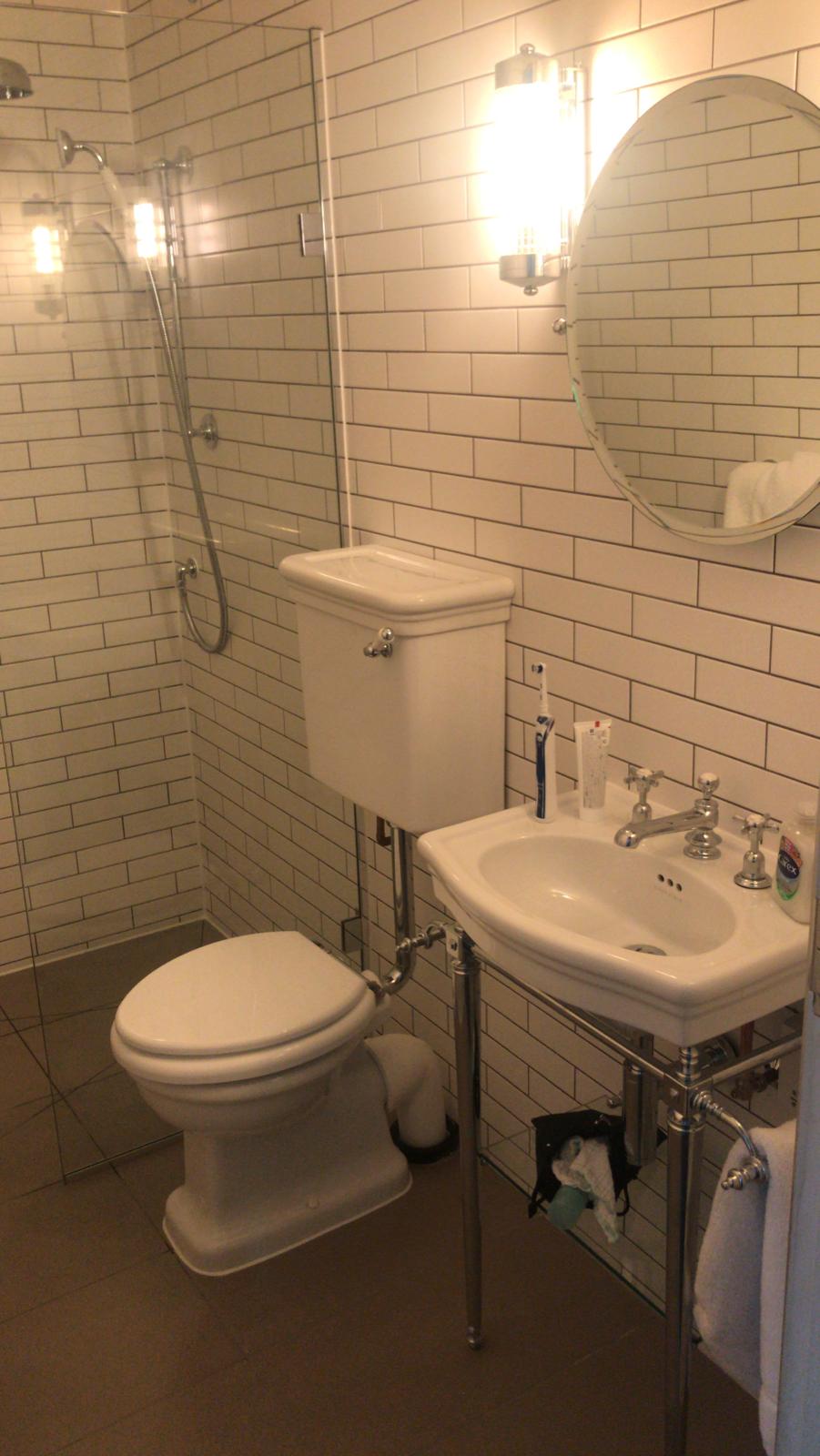 Bathroom wall and floor tiling in a renovation project in Holmfirth